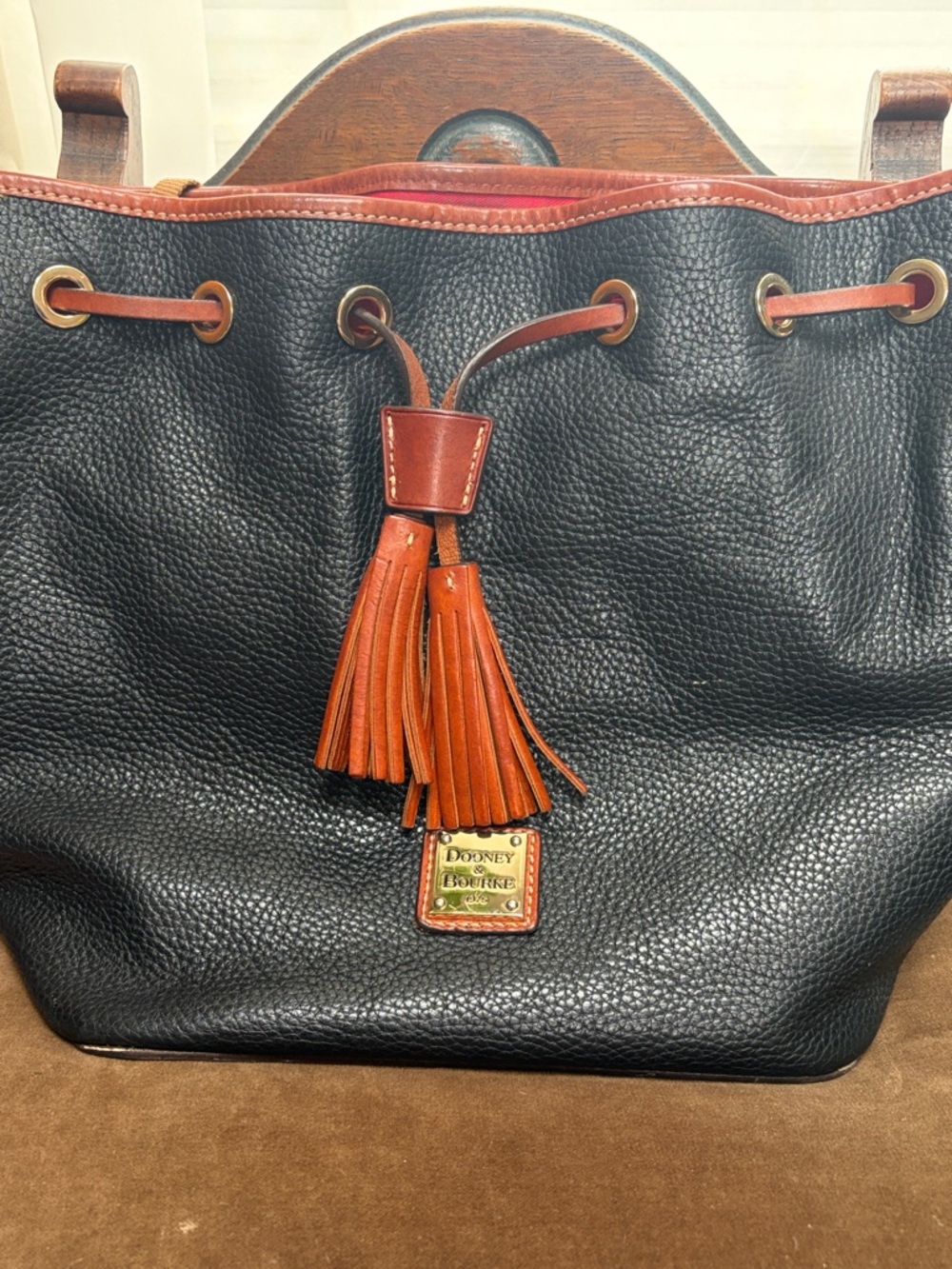 Dooney & Bourke Black Pebbled Leather Tote with Brown leather Trim and Tassel